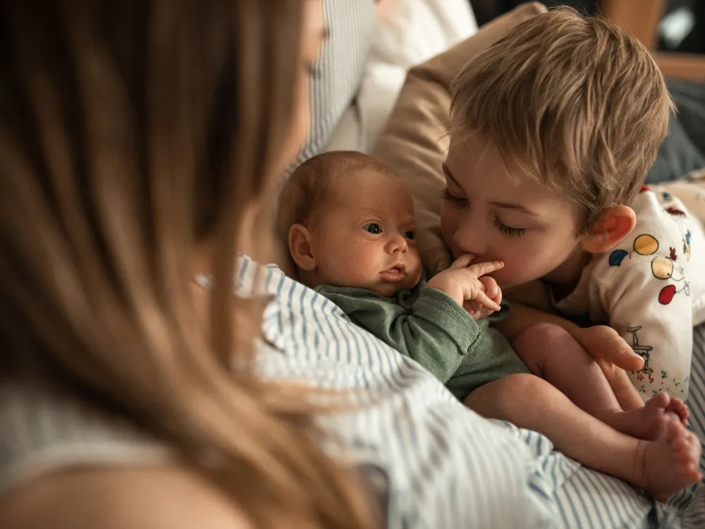 Baby, mother and sibling
