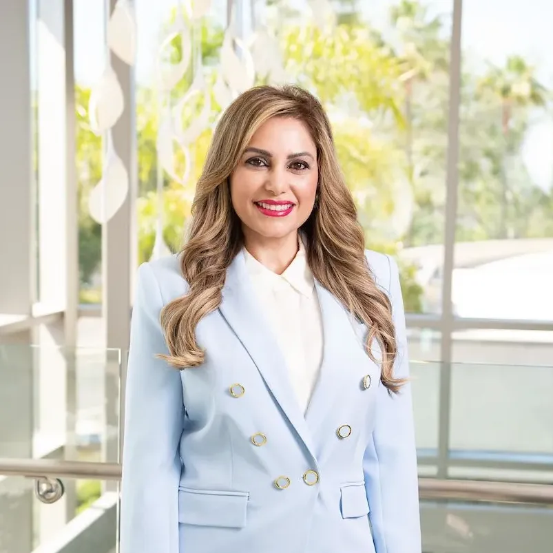 Fertility expert Dr. Susan Nasab smiling and wearing a blue suit